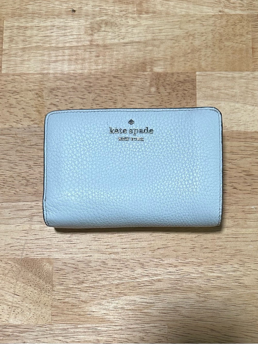 Kate Spade women’s white pebbled leather bifold wallet